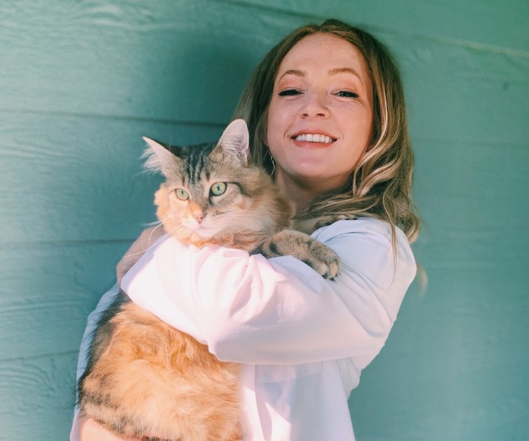 A vet holding a cat